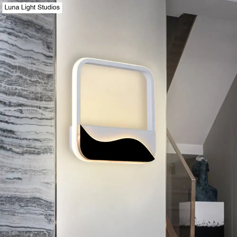 Black White Wall Sconce by Decorbites with white rounded frame and black wave accent on Tampa Home & Garden Store
