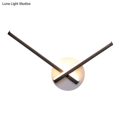 White ceiling light Direct-Wired with crossed dark metal arms over a round white backplate on Tampa Home & Garden Store