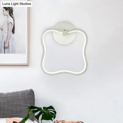White curved square wall sconce with LED edge light and round backplate on Tampa Home & Garden Store