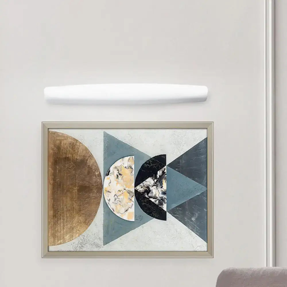 White Modern LED Wall Light curved horizontal bar above a geometric art frame on the wall on Tampa Home & Garden Store