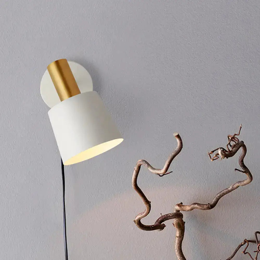 Modern metal drum wall sconce with white shade and gold mount on Tampa Home & Garden Store