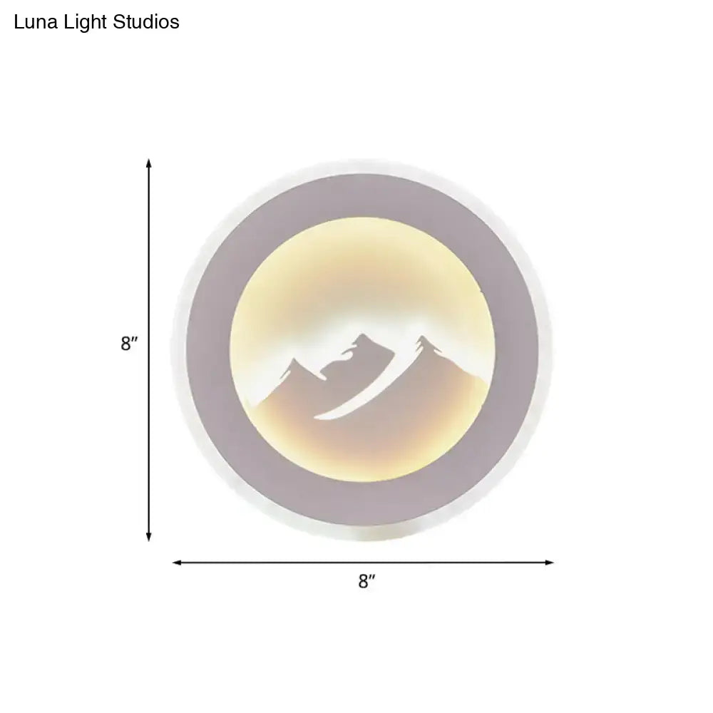 Mountain Silhouette Wall Sconce with purple circular frame and warm backlit peak 8-inch diameter on Tampa Home & Garden Store