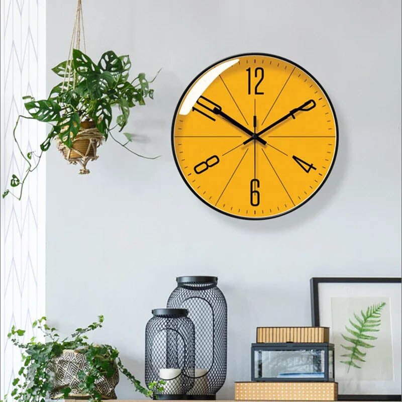Modern Scandinavian wall clock Moktan Sabai round yellow face with bold black hands and numerals on Tampa Home & Garden Store