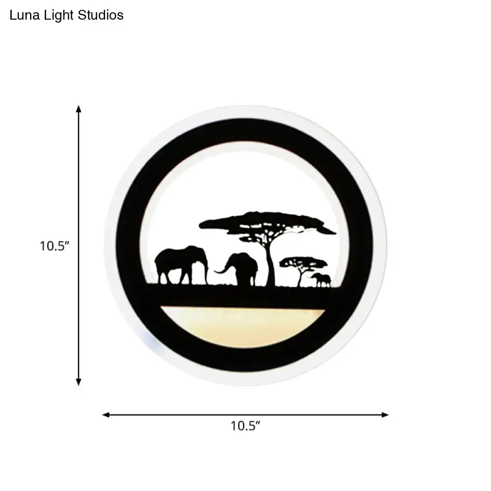 Black acrylic circular wall sconce with elephant silhouettes on savanna scene by Decorbites on Tampa Home & Garden Store