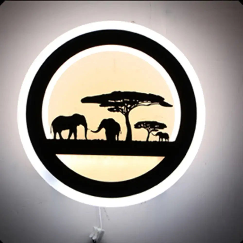 Black acrylic circular built-in shelf wall sconce with elephant silhouettes on Tampa Home & Garden Store