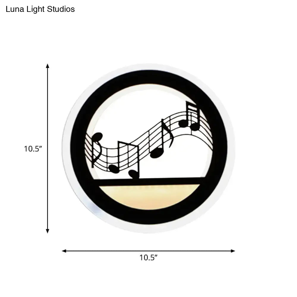 Black acrylic built-in shelf wall sconce by Decorbites; circular ring with musical notes motif on Tampa Home & Garden Store