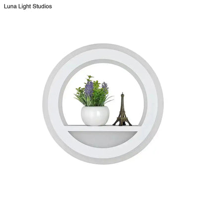 Black acrylic built-in shelf wall sconce with plant and Eiffel Tower decor on Tampa Home & Garden Store