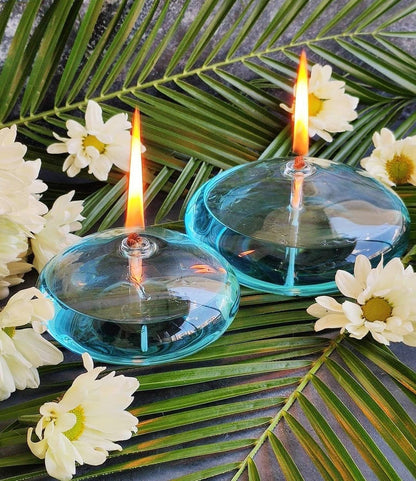 Stevvex teal glass oil lamps, 2 round-base refillable candles with flames, daisies on Tampa Home & Garden Store
