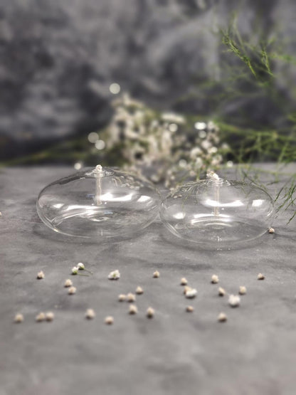 Stevvex clear round glass oil candle set of 2 with wicks on gray surface on Tampa Home & Garden Store