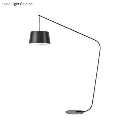 Arc floor lamp with black metal frame and drum shade on Tampa Home & Garden Store