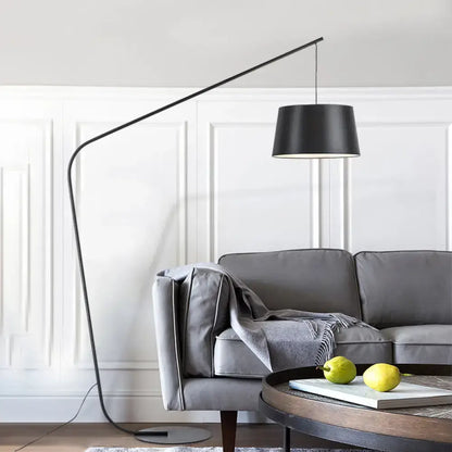 Olive Upholstered Armchair from Decorbites in a gray modern living room with arc floor lamp on Tampa Home & Garden Store