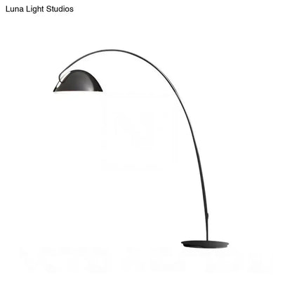 Arc floor lamp with curved black stem and metal dome shade on Tampa Home & Garden Store