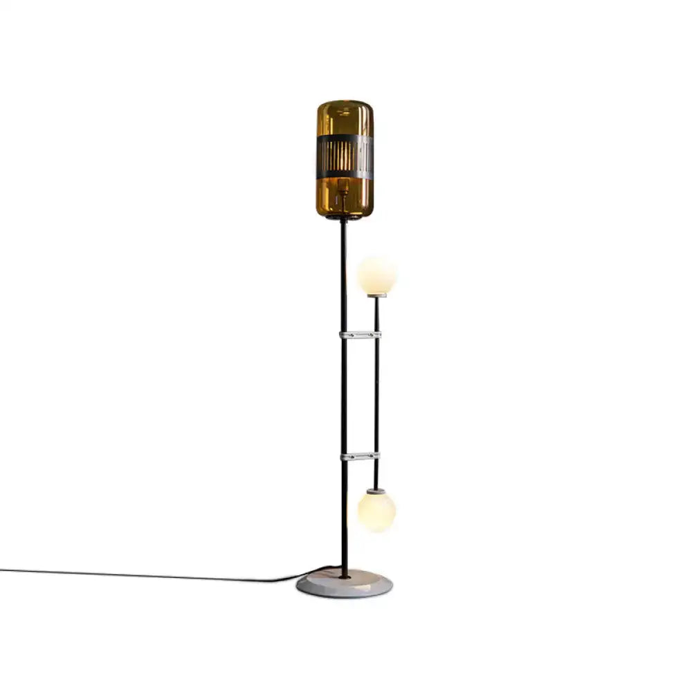 Floor lamp with amber glass shade and frosted globe bulbs black metal stem on Tampa Home & Garden Store
