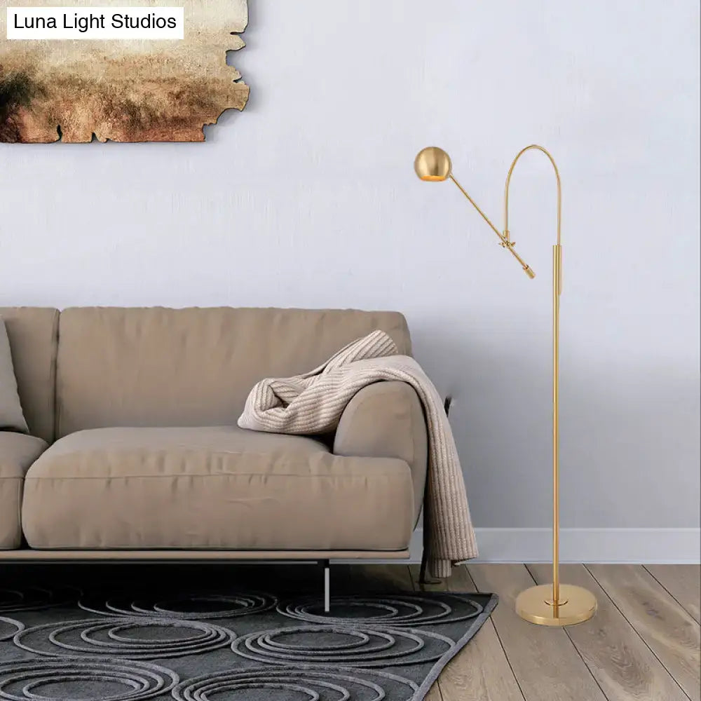 Olive upholstered armchair in a modern living room with beige sofa and gold floor lamp on Tampa Home & Garden Store