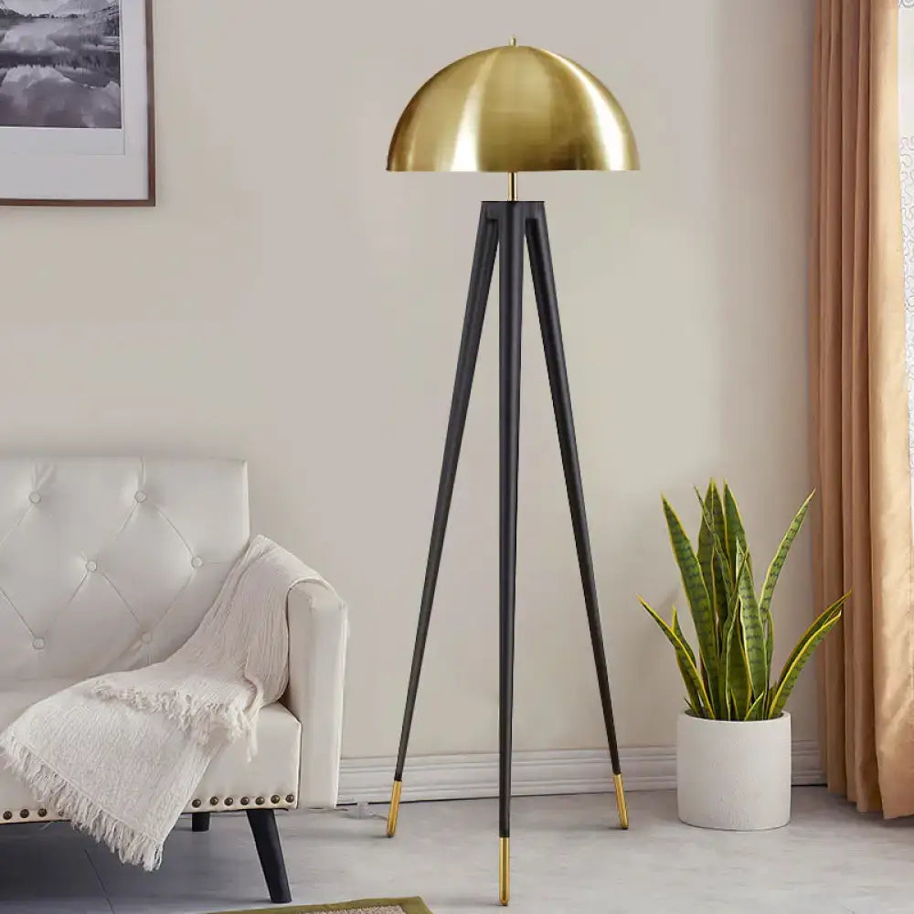 Olive Upholstered Armchair accent chair with black tripod floor lamp and brass dome shade in a modern living room on Tampa Home & Garden Store