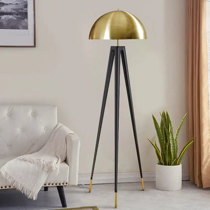 Olive Upholstered Armchair accent chair with black tripod floor lamp and brass dome shade in a modern living room on Tampa Home & Garden Store