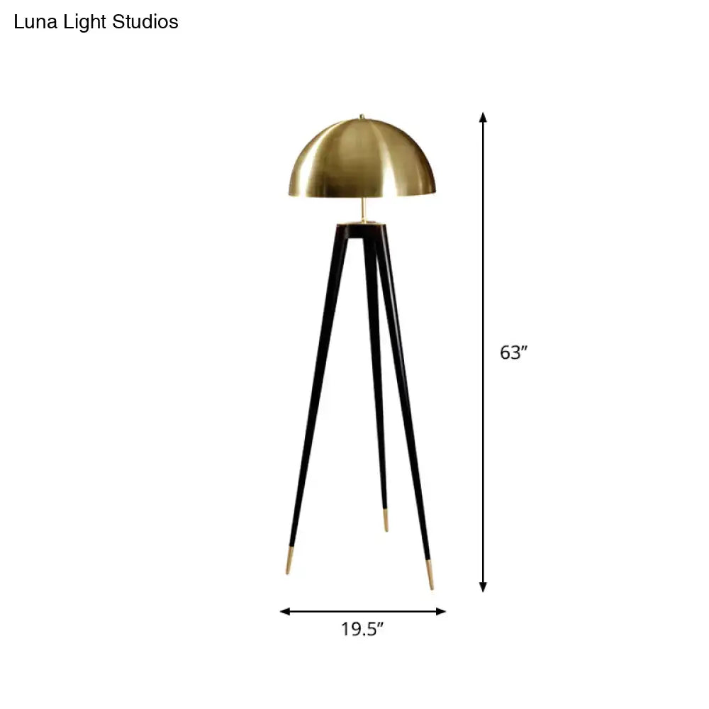Tripod floor lamp with brass dome shade and black legs with gold tips, 63 inches tall on Tampa Home & Garden Store