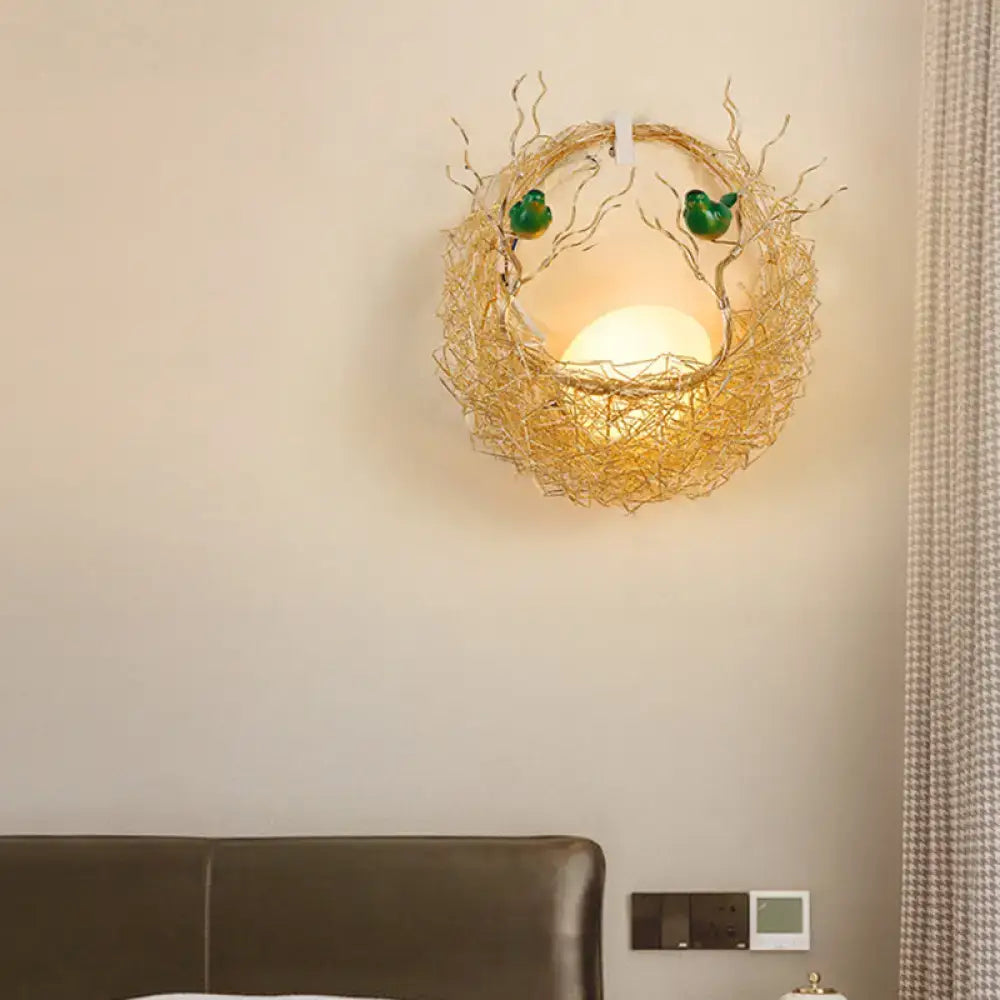 Opal glass bird nest sconce with warm glow, woven frame and two green birds Decorbites on Tampa Home & Garden Store