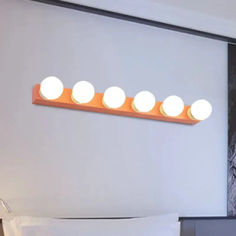Modern orange and white 3-bulb vanity light fixture for bedroom by Decorbites mounted on wall on Tampa Home & Garden Store
