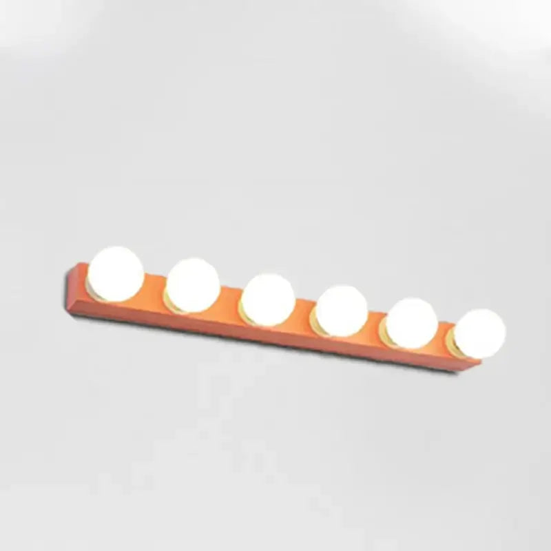 Orange six-bulb vanity light fixture with frosted white bulbs on a rectangular base on Tampa Home & Garden Store
