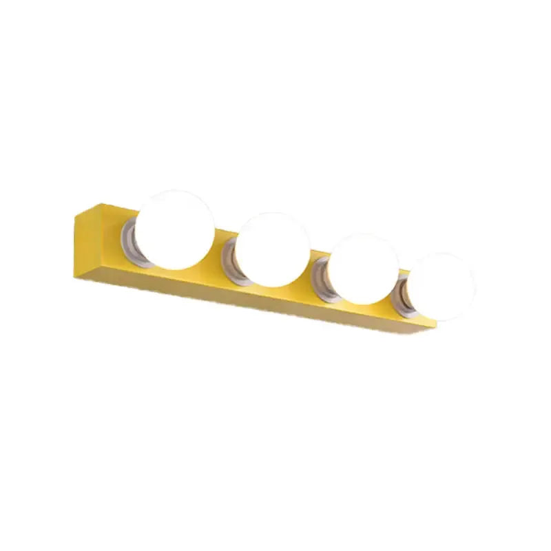 Modern orange and white 3-bulb vanity light with white globe bulbs on a yellow backplate on Tampa Home & Garden Store
