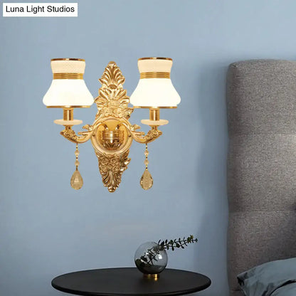 Gold frosted wall sconce with ornate backplate and dual lamps by Decorbites on Tampa Home & Garden Store