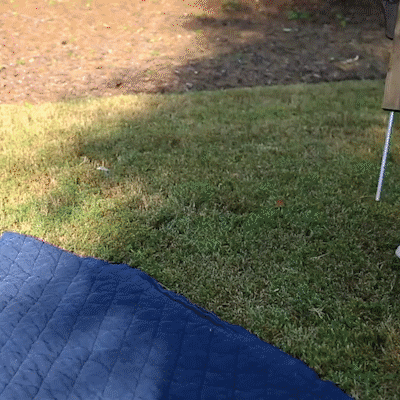 Modern outdoor portable foldable wood wine table on grass blue mat and metal leg visible on Tampa Home & Garden Store