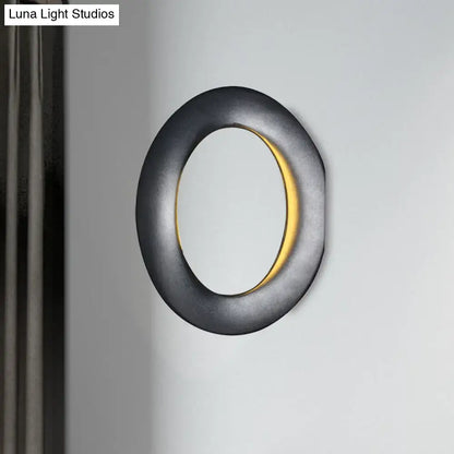 Black LED aluminum circline wall light by Decorbites with warm glow on Tampa Home & Garden Store