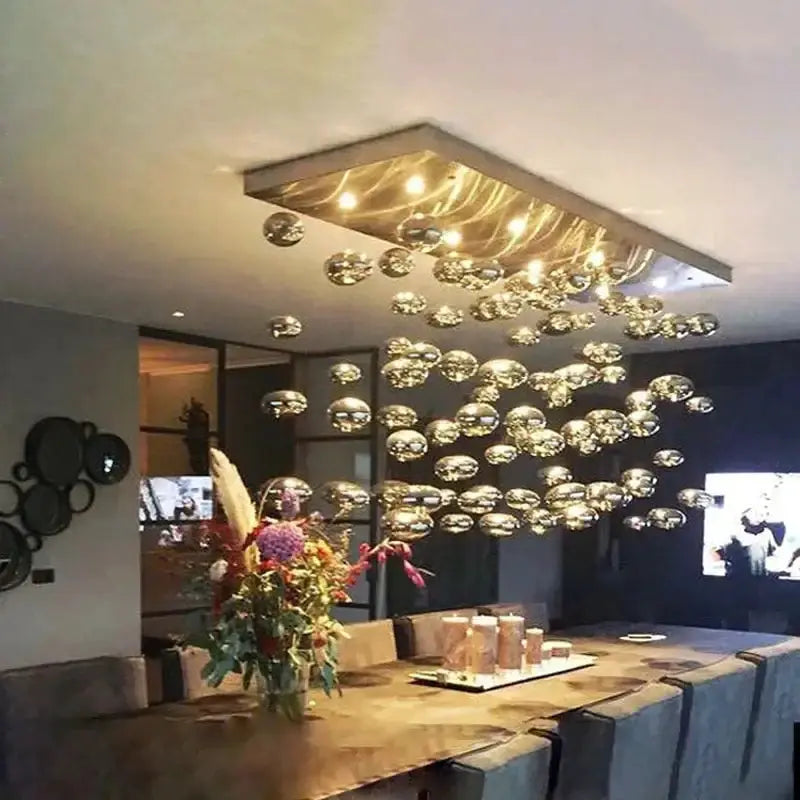 Modern oval bubble ball silver chandelier over dining table with hanging glass orbs on Tampa Home & Garden Store