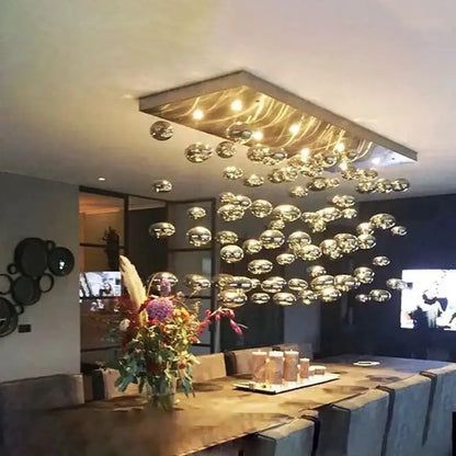 Modern oval bubble ball silver chandelier over dining table with hanging glass orbs on Tampa Home & Garden Store