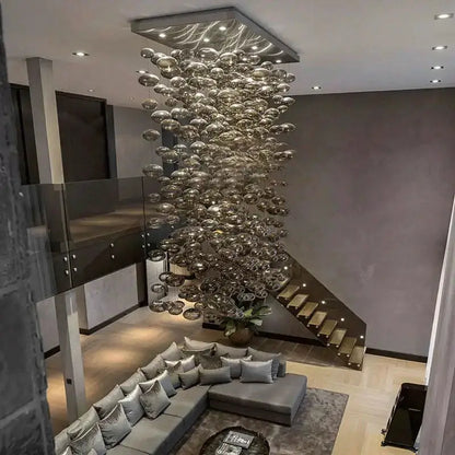 Modern oval bubble ball silver chandelier by Decorbites with glass spheres over sectional on Tampa Home & Garden Store