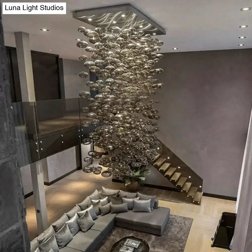 Modern oval bubble ball silver chandelier hanging from ceiling over living room Decorbites on Tampa Home & Garden Store