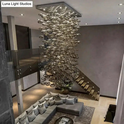 Modern oval bubble ball silver chandelier hanging from ceiling over living room Decorbites on Tampa Home & Garden Store