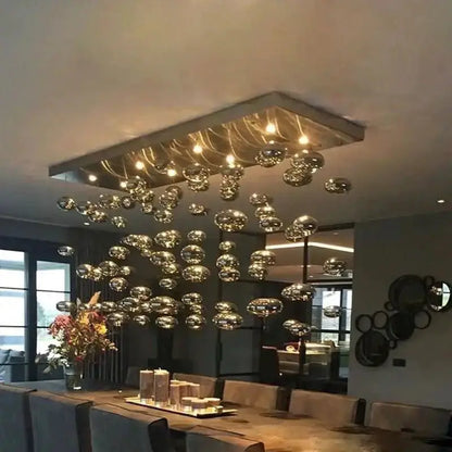 Modern oval bubble ball silver chandelier with hanging glass spheres over dining area on Tampa Home & Garden Store