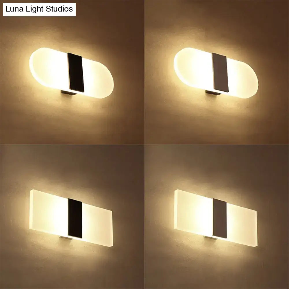 Decorbites metal oval LED wall sconce with frosted glass and black center stripe, four angles on Tampa Home & Garden Store