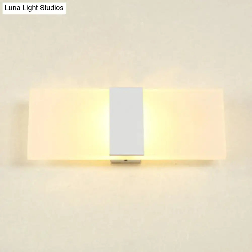Metal oval LED sconce by Decorbites with white shade and central bar, warm wall light on Tampa Home & Garden Store