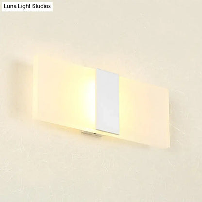 Metal oval LED wall sconce by Decorbites with warm glow on Tampa Home & Garden Store