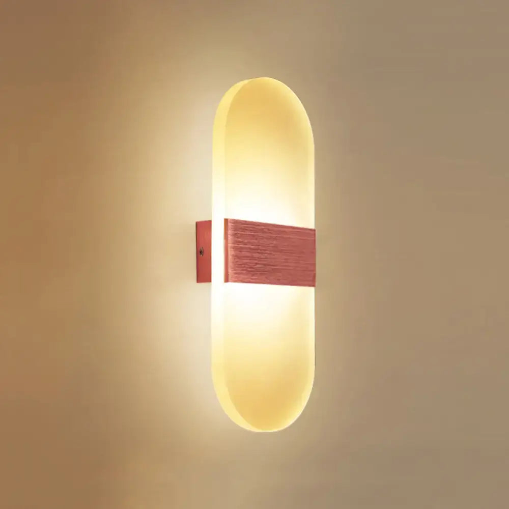 Metal Oval LED Sconce with warm white glow and wood accent by Decorbites on Tampa Home & Garden Store