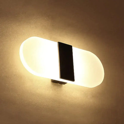 Metal oval LED wall sconce with black center divider and frosted glass, Decorbites on Tampa Home & Garden Store