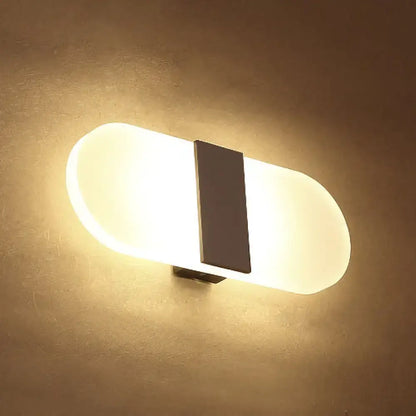 Metal oval LED wall sconce with frosted diffuser and dark vertical bracket Decorbites on Tampa Home & Garden Store