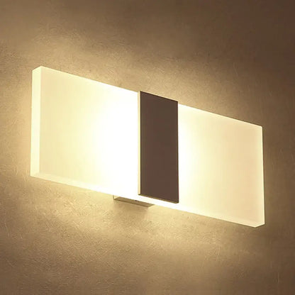 Metal oval LED wall sconce by Decorbites with white panels and dark stripe on Tampa Home & Garden Store