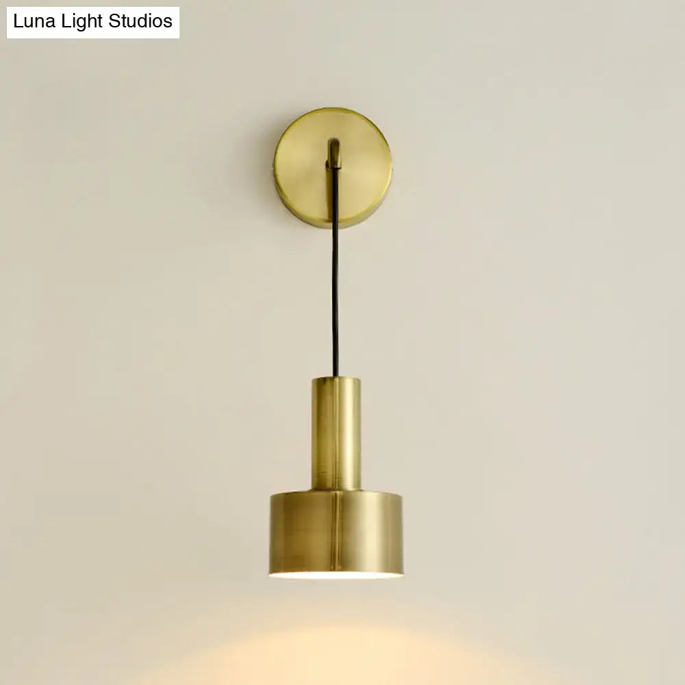 Pink brass wall lamp with round backplate and cylindrical shade, modern home decor on Tampa Home & Garden Store