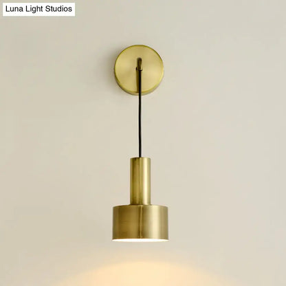 Pink brass wall lamp with round backplate and cylindrical shade, modern home decor on Tampa Home & Garden Store