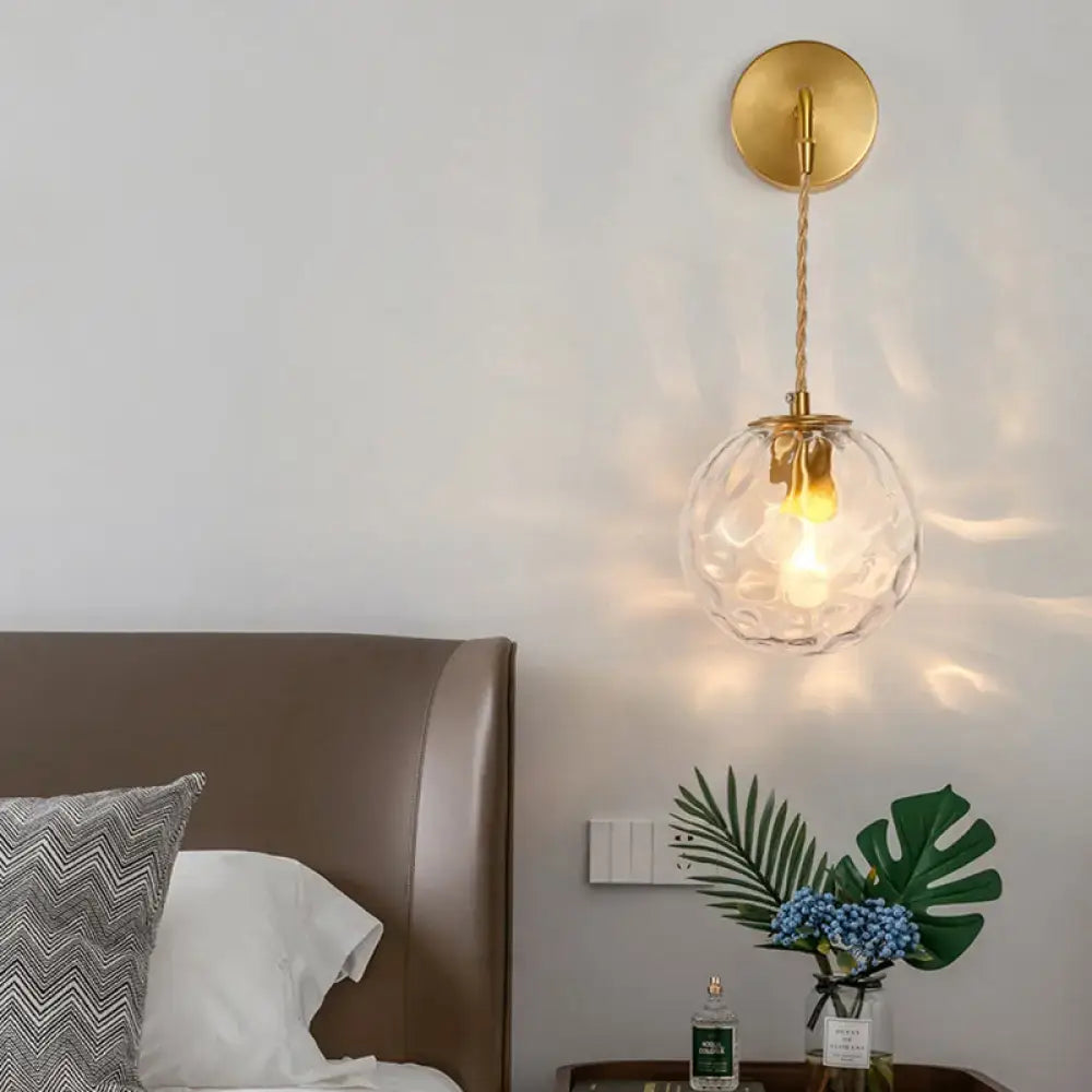 Pink brass wall lamp with textured glass globe and gold canopy Decorbites on Tampa Home & Garden Store