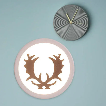 Pink deer wall sconce with warm glow and bronze silhouette gray ribbed wall clock Decorbites on Tampa Home & Garden Store