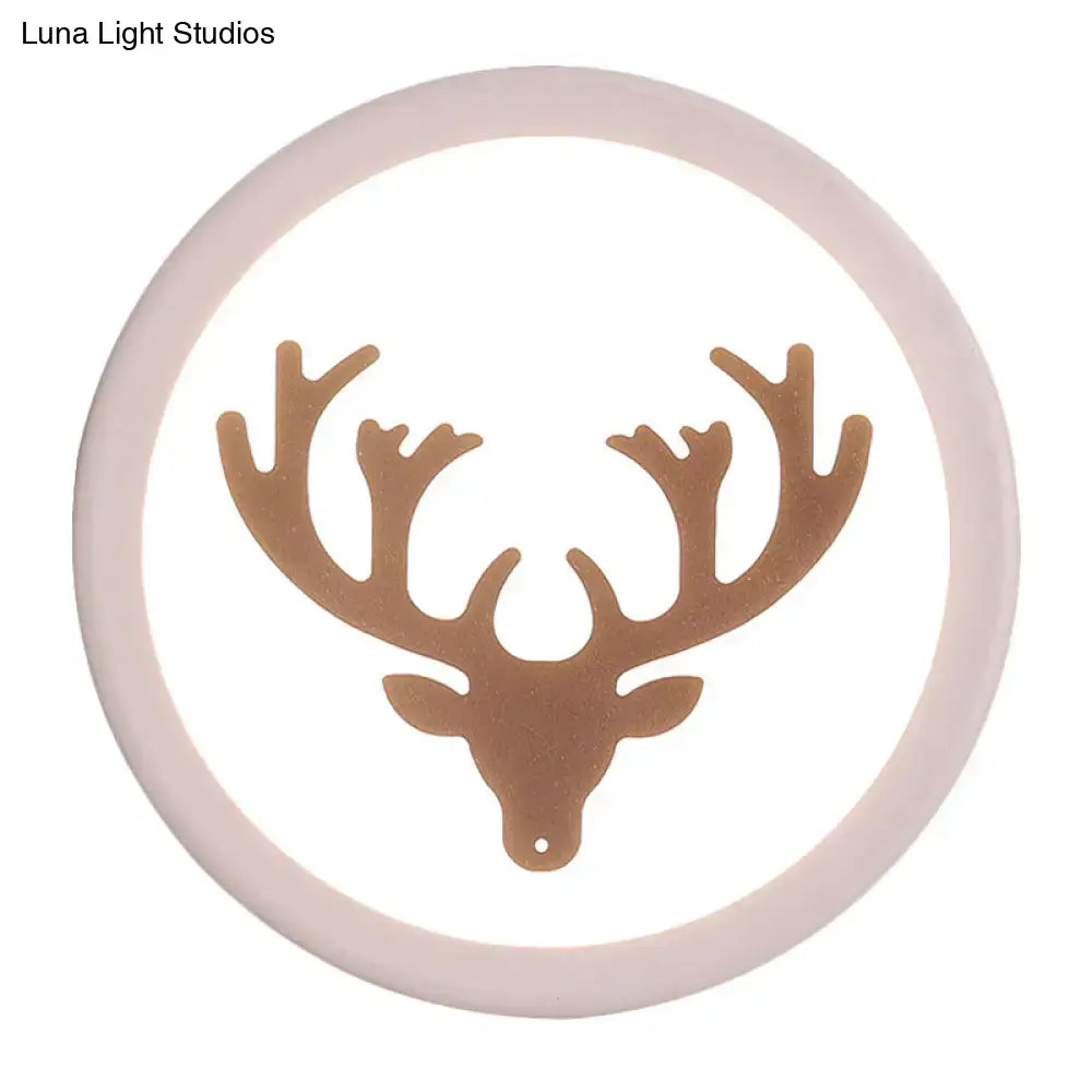 Pink deer wall sconce with gold silhouette inside a soft pink circular frame by Decorbites on Tampa Home & Garden Store