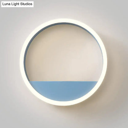Modern iron hoop wall light with circular LED ring and blue lower panel on Tampa Home & Garden Store