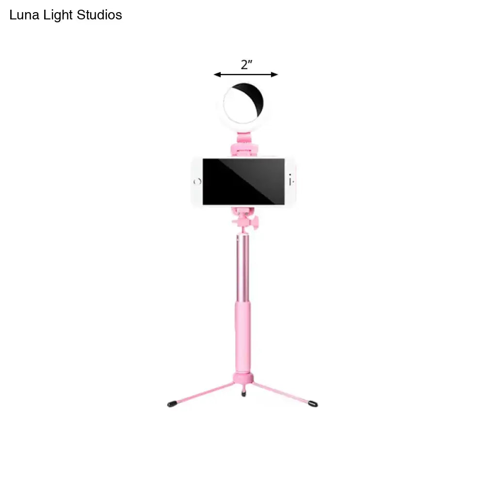Pink circle LED mirror mounted on a pink selfie-stick tripod with smartphone on Tampa Home & Garden Store