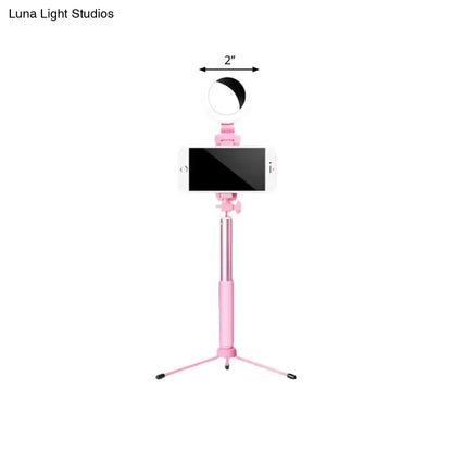 Pink circle LED mirror mounted on a pink selfie-stick tripod with smartphone on Tampa Home & Garden Store