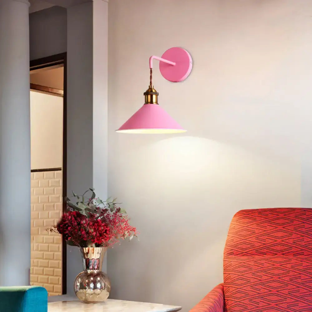Pink conical metal sconce by Decorbites, wall-mounted with brass neck and soft illumination on Tampa Home & Garden Store
